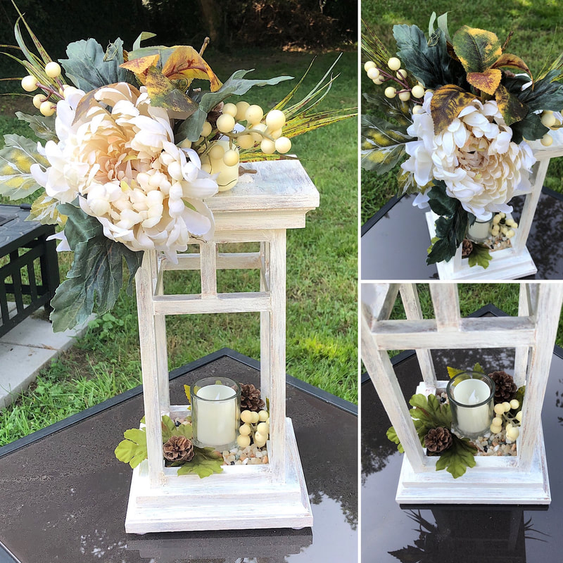 Fall themed handcrafted wood lantern candleholder with faux floral arrangement.