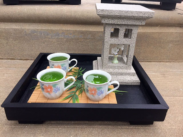 Handcrafted wood Japanese themed tea tray with repurposed tea cups.