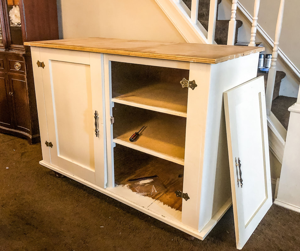In progress photo of a DIY project refinishing a freestanding cabinet.