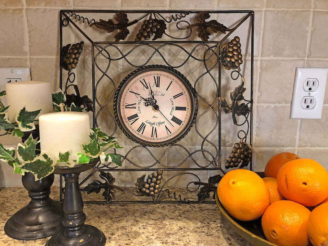 Thrifted clock on kithcen counter.