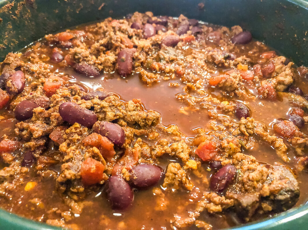 Chili cooking in a crockpot.