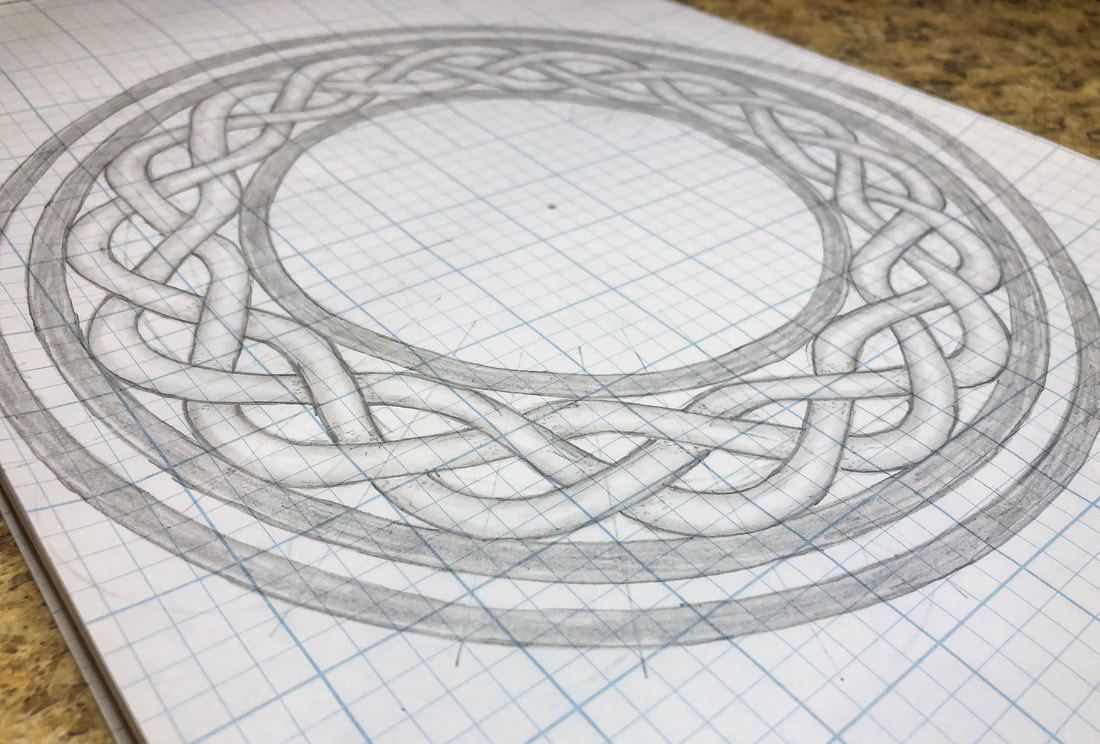 Circular Celtic knot on grid paper.