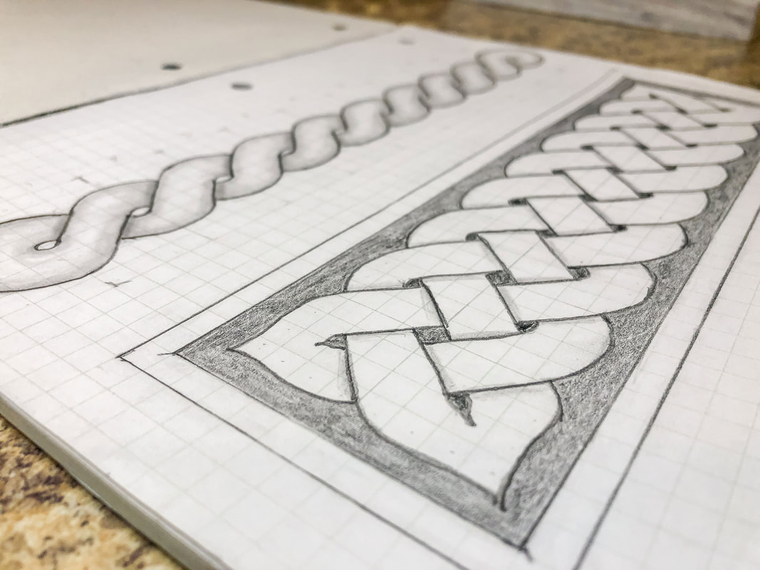 Hand drawn knotwork on grid paper.