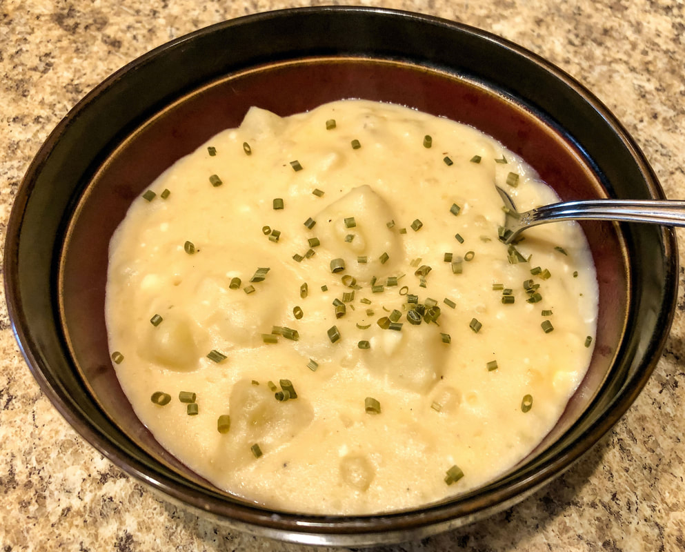 Bowl of homemade creamy potato soup.