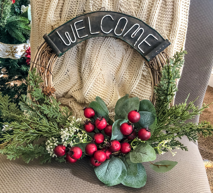 DIY Christmas wreath with faux greens and berries.
