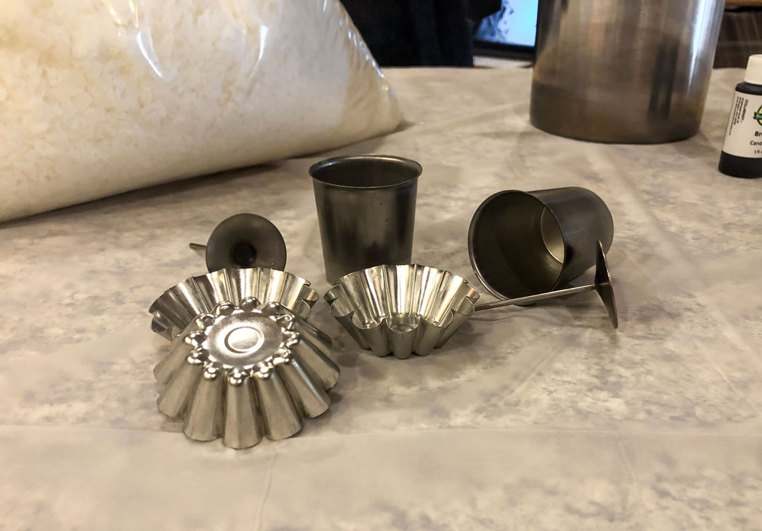 Metal floating candle and votive molds for homemade candles.