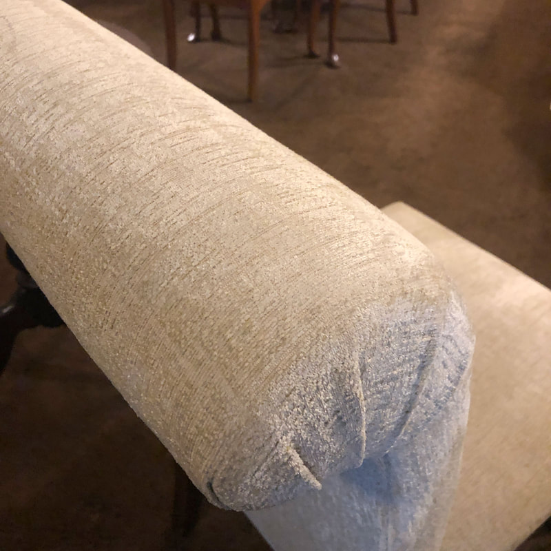 Rolled back of a side chair.