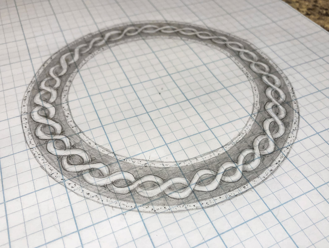Circle ring border knot sketch on grid paper.