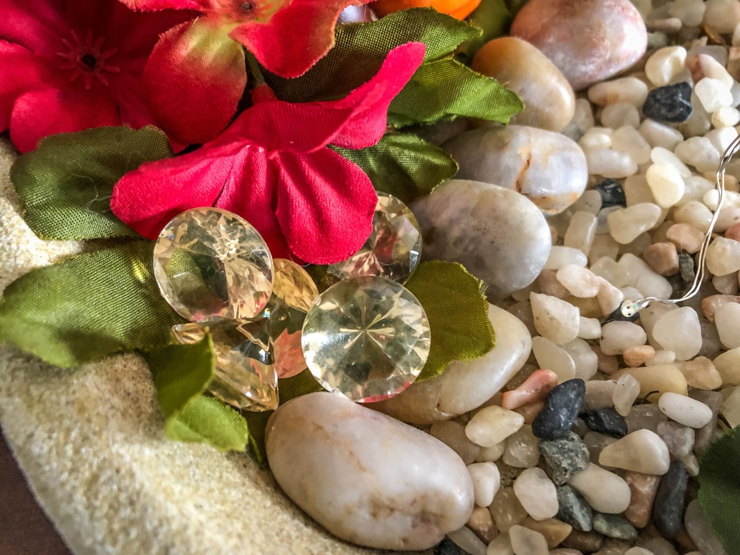 Sparkly gold crystal gemstones in a fairy garden.