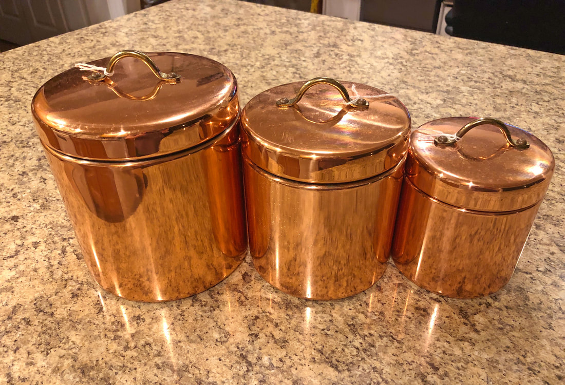 Round copper tins.