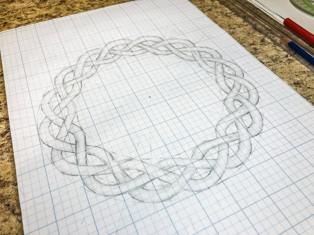 Rough sketch of a circular Celtic knot on grid paper.
