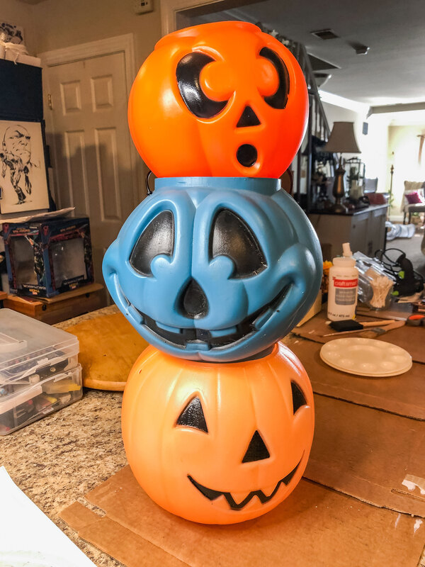 Plastic Halloween candy buckets stacked.