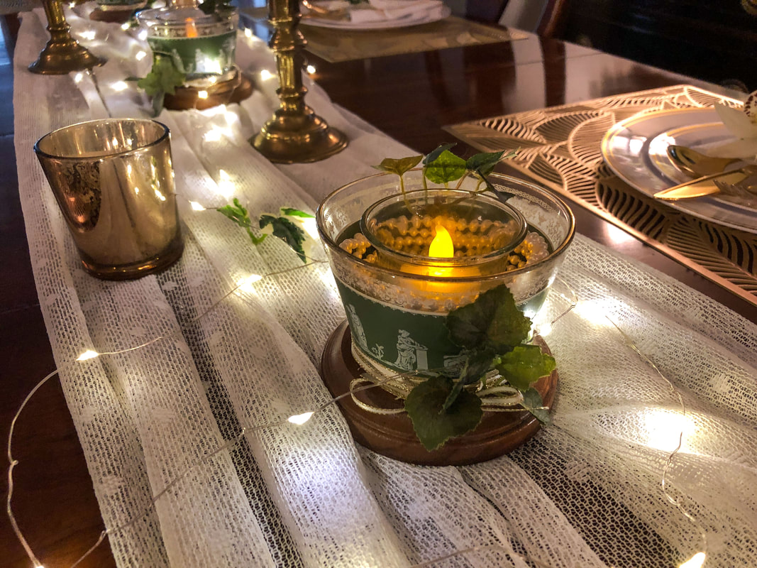 Fairy lights and LEDS light up a dining room tablescape.