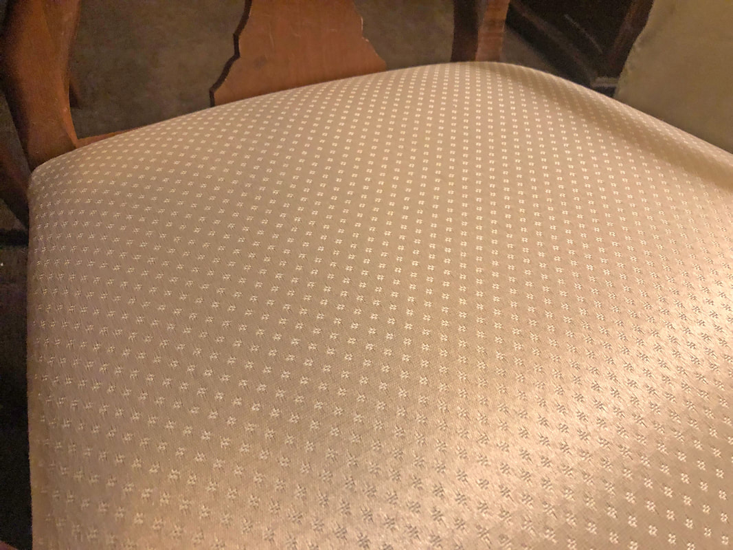 Closeup of recently cleaned dining room chair upholstery.