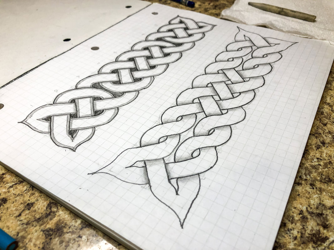 Pencil drawn Celtic knots on grid paper.