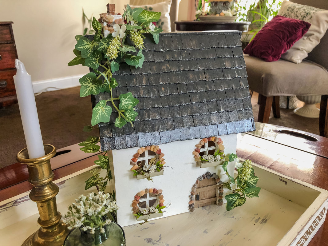 Handcrafted indoor fairy cottage.