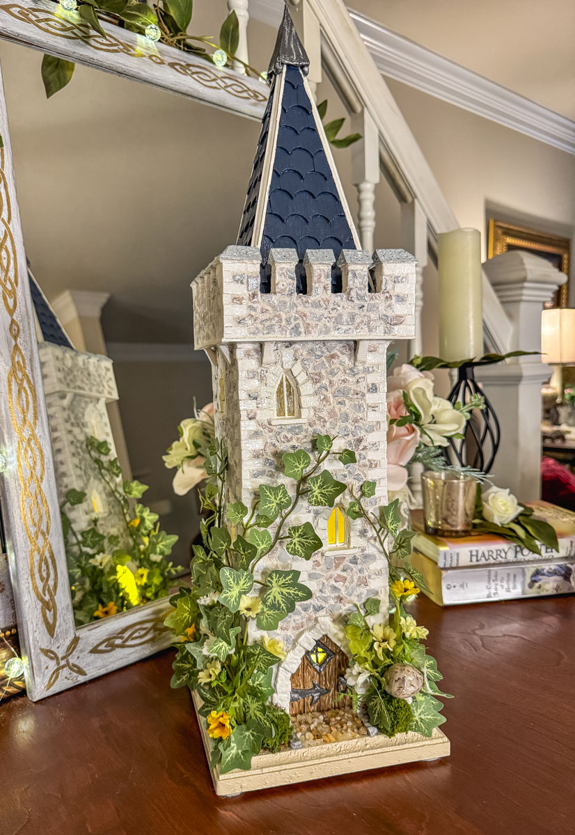 Handcrafted miniature fairy castle tower lit with fairy lights.