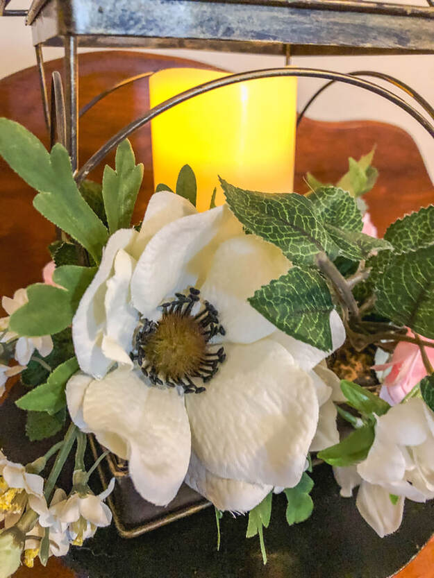 White anemone in a faux floral arrangement.